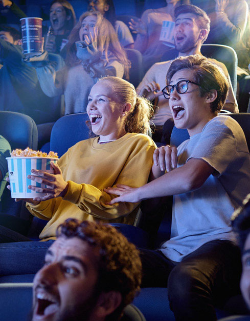 Couple Watching Movie and Eating Popcorn