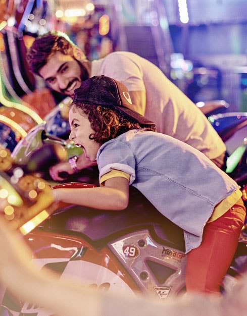 Boy Playing Arcade Games